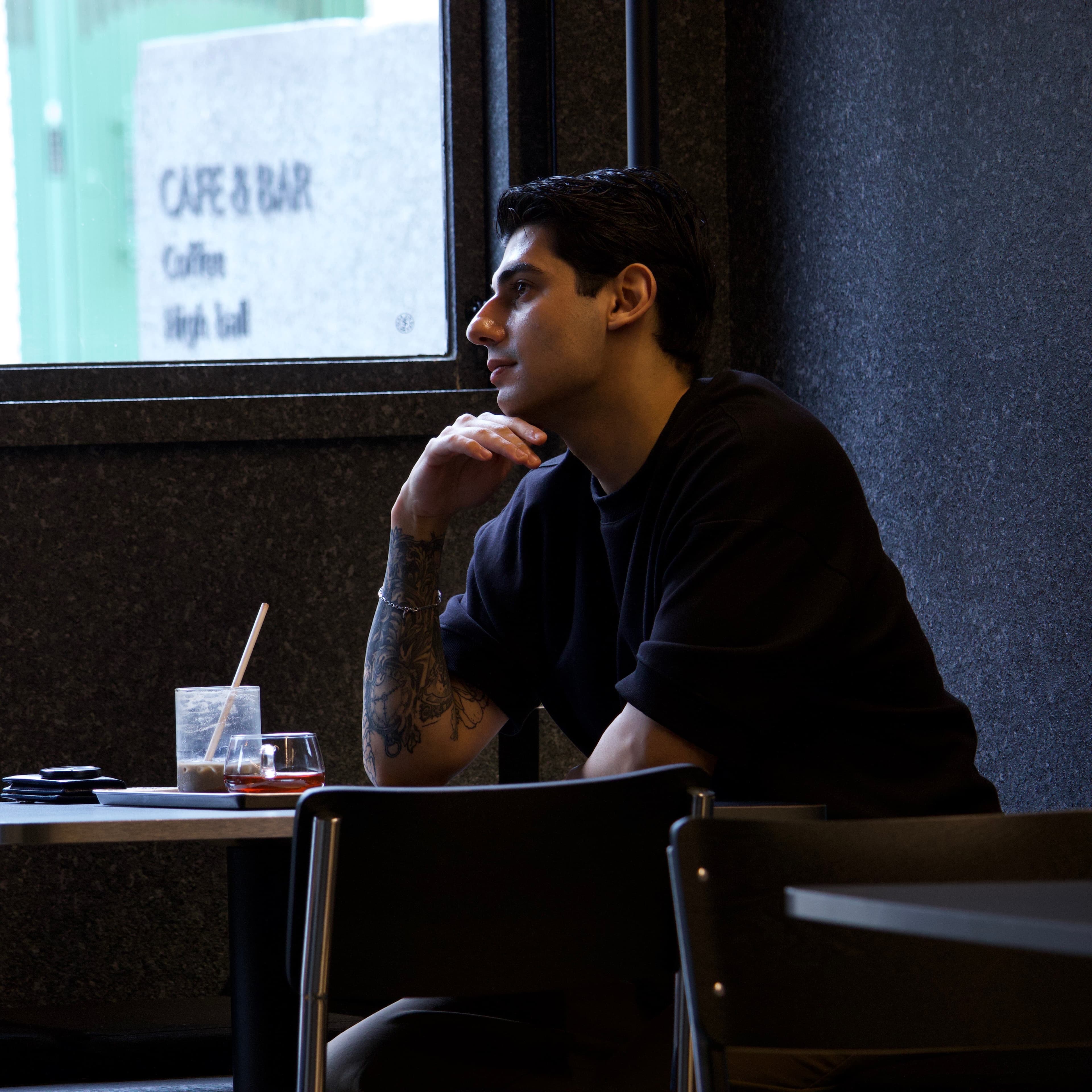 Sitting by a cafe window